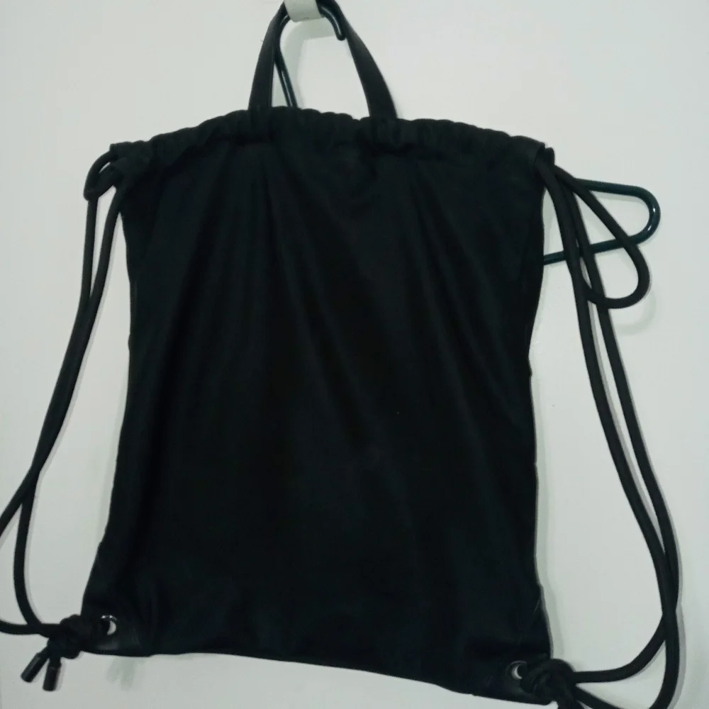 DKNY RAISED RAINBOW LETTER HEAVYWEIGHT DRAWSTRING BACPACK W MULTIPLE POCKETS